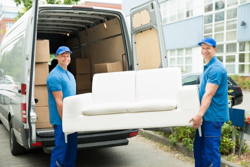 Loading furniture into a van for a Chalkfarm delivery