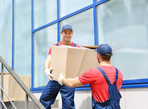 Team safely loading furniture into a van