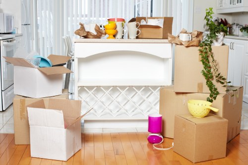 Professional movers transporting boxes and furniture in Chalkfarm