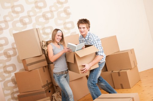 Residential removals team handling furniture in Chalkfarm