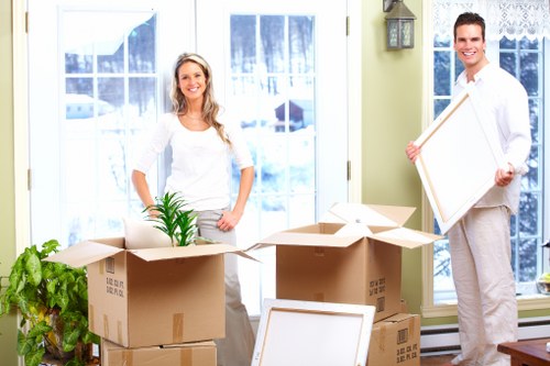 Local movers handling office furniture and boxes in a Chalkfarm commercial relocation